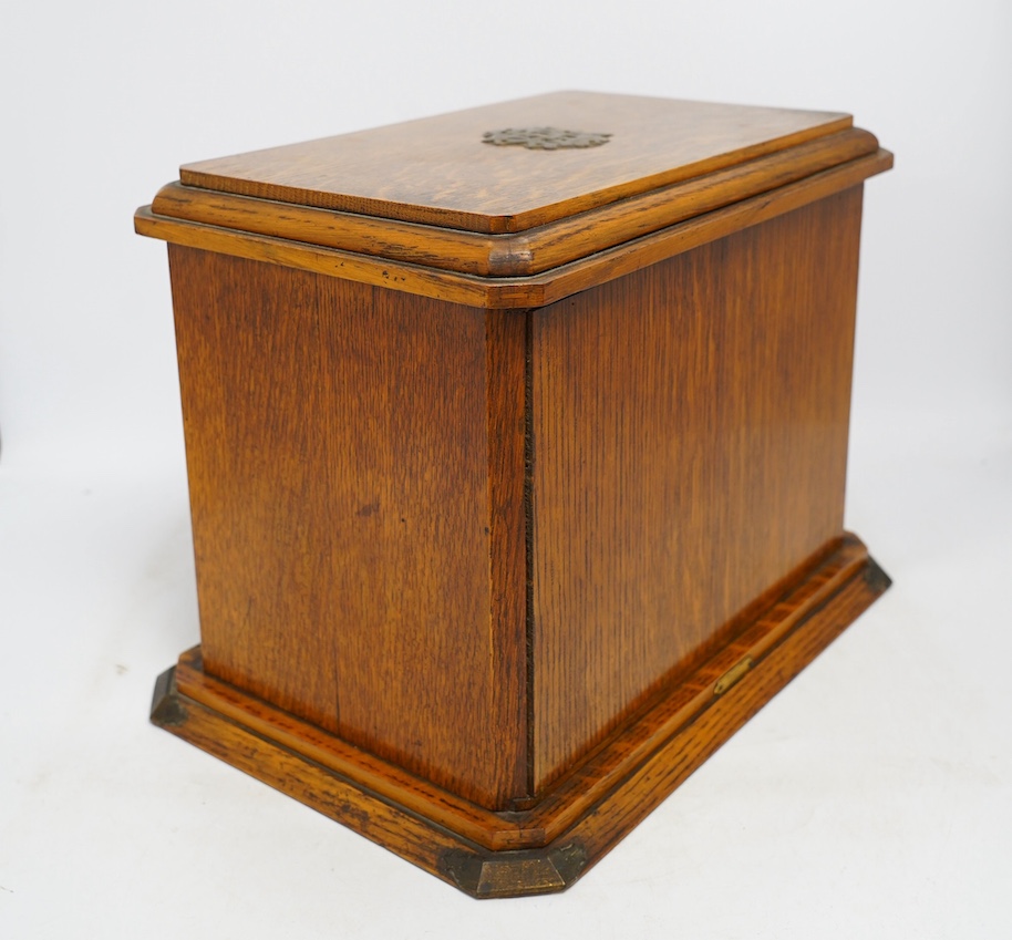 An early 20th century oak collector's cabinet, retailer Fisher, 188 Strand, 38cm wide. Condition - fair